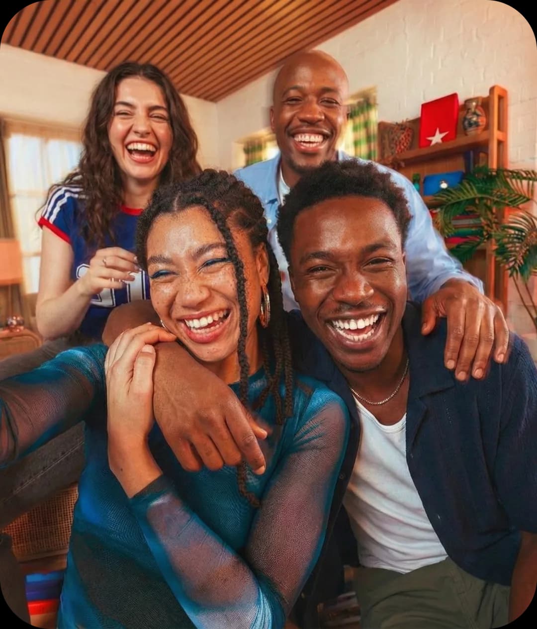 Friends laughing together in a living room