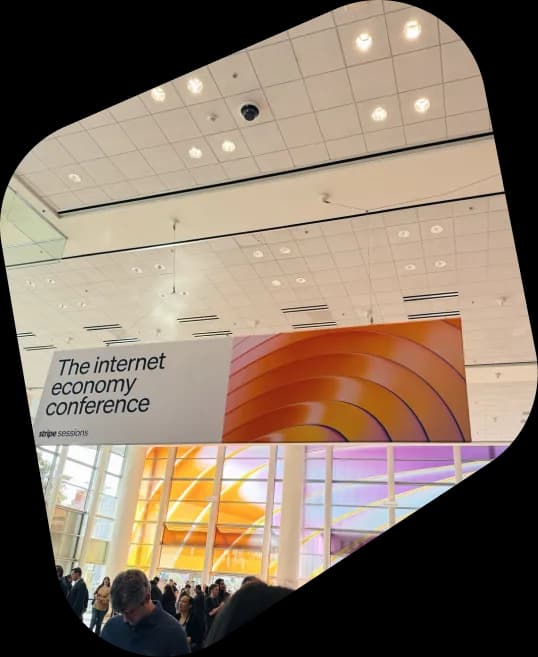 Attendees gathered inside a bright conference venue